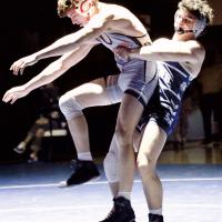 Spencer Davidson lifts a Comanche wrestler into a throw