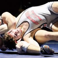 Spencer Davidson tries a pinning move on Logan Bair