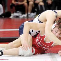 Foxx Kurtz throws an arm across the face of a Claremore wrestler