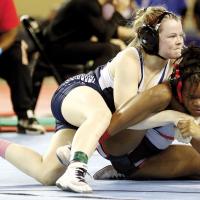 Brooklynn Huggins sets up a pinning move on Ma’Kadrian Titus
