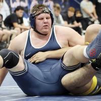 J.T. Higgins leans back into a Santa Fe South opponent while setting up a pinning move