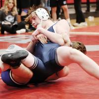 Logan Snyder leans back into a pinning move