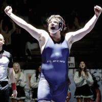 Jaren May raises his arms and yells to the crowd after earning his first win of the season