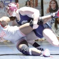 Laila Hustoles throws her Del City opponent to the mat early in their match