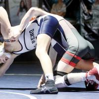 Mason Hoffman tries to pull away the hand of a Del City wrestler