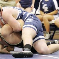 Ryan Sigler hooks the arm of Noah Haydon as he sets up a pin attempt