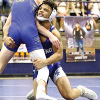 Daegen Griffin shoots in for a double-leg takedown move on an opponent