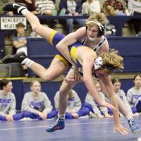 Kylar Kurtz jumps off the mat as he throws Cash Donnell to the ground