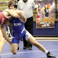 Thad Hicks works the head and neck of an opponent