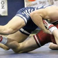 Spencer Davidson grabs the ankle of Ethan Teague