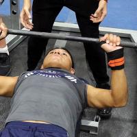 Juneau Klinekole attempts a lift in the bench press portion of the state meet