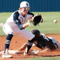 Davin Shamblin eyes a pickoff throw as a runner slides into second base