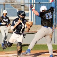 Austin Castanon pulls back his glove after making a tag