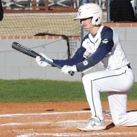 Ty Vincent goes down to one knee to drop down a bunt
