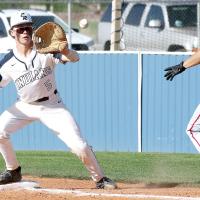 Gabe Compton eyes a throw to the bag just ahead of a Ponca City runner