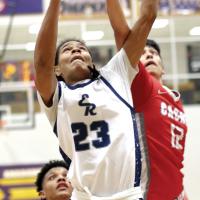 Phoenix Whiteshirt outjumps a Cache player for a rebound