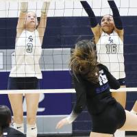 Jillian Reavis (3) and Mary Gonzalez (16) just miss a double block attempt