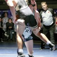 Theron Davis lifts a Midwest City wrestler as he sets up a takedown