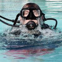 Trent Bryan breaks the surface at the city’s municipal pool