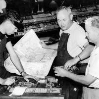 Former El Reno Tribune workers setting up a page in the pressroom