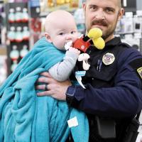 Police Sgt. Steven Kennedy carries Josiah Todd