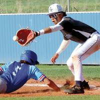 Hernan Blanco reaches over a Guthrie base runner to glove a pickoff throw
