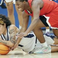 Exodus Satepauhoodle dives onto the floor to gain control of a loose ball
