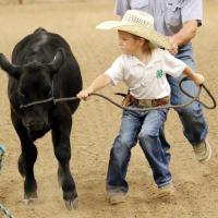 Gatlyn Gracia pulls tight on the rope as he tries to keep his calf from bolting