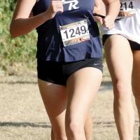 Emmary Elizondo leads two runners at the Edmond Santa Fe Pre-State Meet
