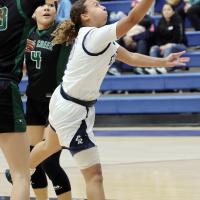 Jaida Richardson gets off a layup after dribbling between two Pine Creek defenders