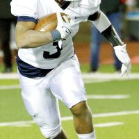 Malachi Nicholson looks for a running lane