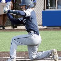 Ty Vincent grimaces as he kneels down for a bunt attempt