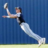 Mason Fulton dives to make a backhanded catch