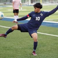 Edgar Perez stretches out his leg to block a pass