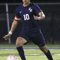 Edgar Perez dribbles down the field