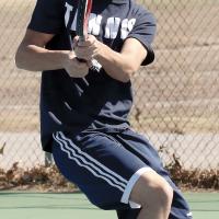 Jacob Guerrero follows through on a backhand return shot