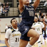 Kaleb Blackwolf shoots a running layup