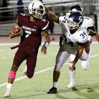 Mikey Devereaux reaches out to grab a ball carrier