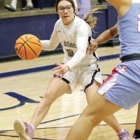 Reagan Bugaj works the ball into the front court