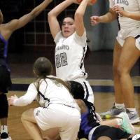 Carley Kihega looks to make a pass after coming up with a loose ball