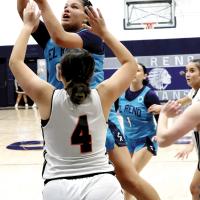 Lilly Thomas shoots a jumper in the lane