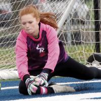 Bri Vickers dives for the ball which slipped her grasp