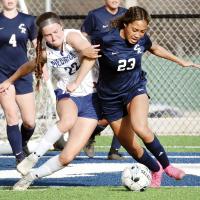 Ja’Niya Loreto (23) gets her arm hooked with a Piedmont player