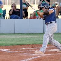 C.C. Medders slaps a hit down the third-base line