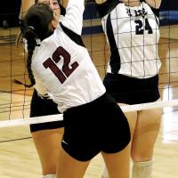Emercyn Looper (left) and Jewell Graham attempt to knock down the ball
