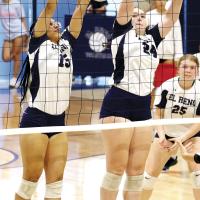 Qyra Jones (left) and Jewell Graham jump for a double block attempt