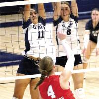 Meredick Martinez (11) and Brantlie Charmasson (8) attempt to block a shot