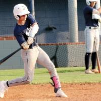 Gabe Compton takes a cut at a pitch