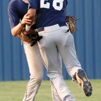 Jaxon Good and Hernan Blanco collide as a pop-up falls to the ground