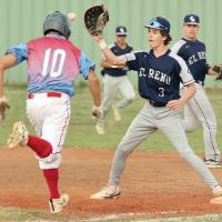 Coy Atkins keeps his eyes on the ball while covering first base as a Western Heights runner tries to beat out the throw